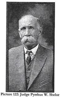 An old photo of a person wearing a suit and tie

Description automatically generated