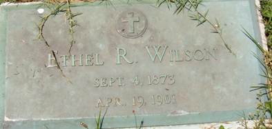 A grave stone with a cross and a cross on it

AI-generated content may be incorrect.