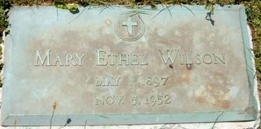 A grave stone with a cross and a cross on it

AI-generated content may be incorrect.